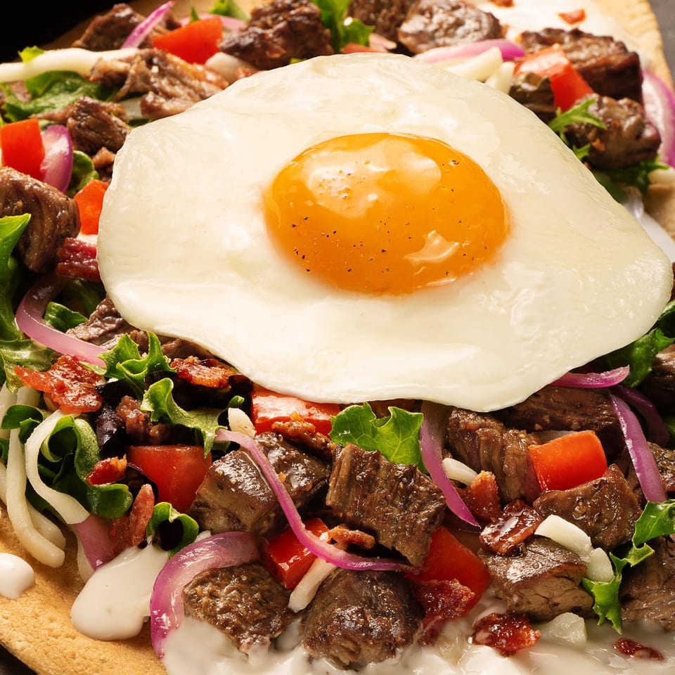 Savory crêpe topped with a fried egg